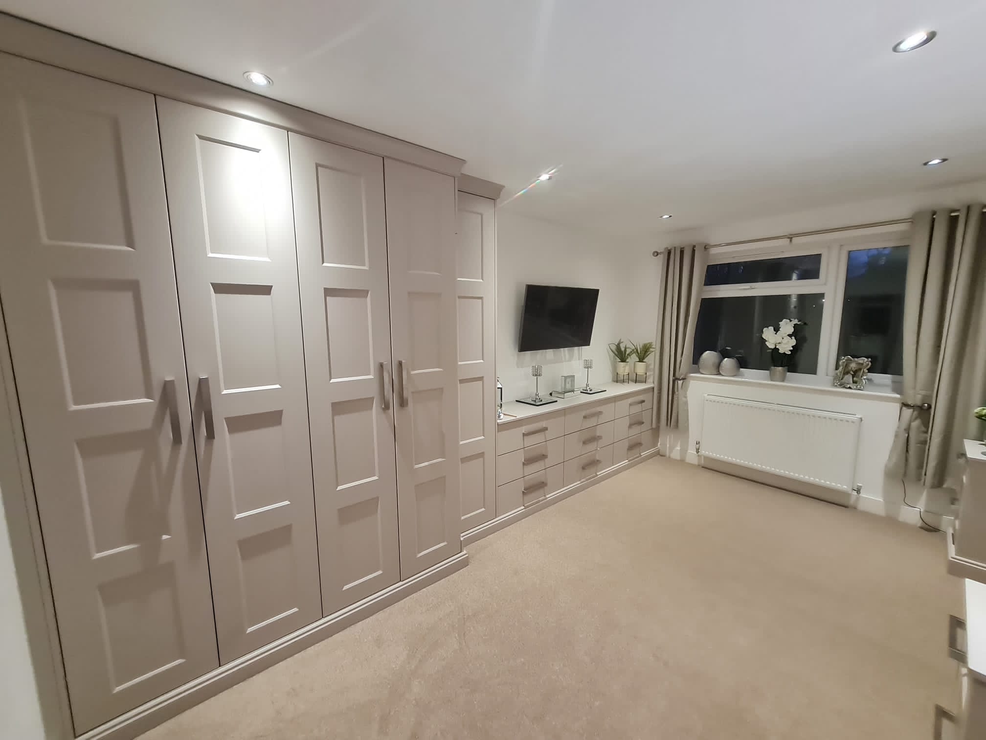 hand crafted fitted wardrobes and vanity unit with drawers.
